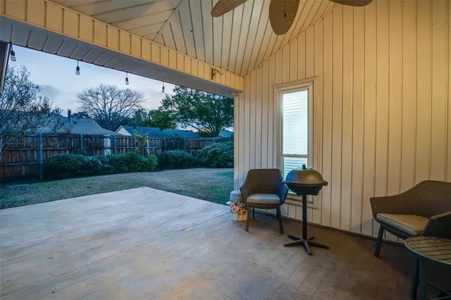 a bathroom with a granite countertop toilet sink and mirror