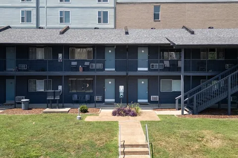a front view of a building with swimming pool