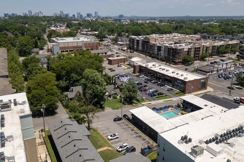 an aerial view of a house with a garden