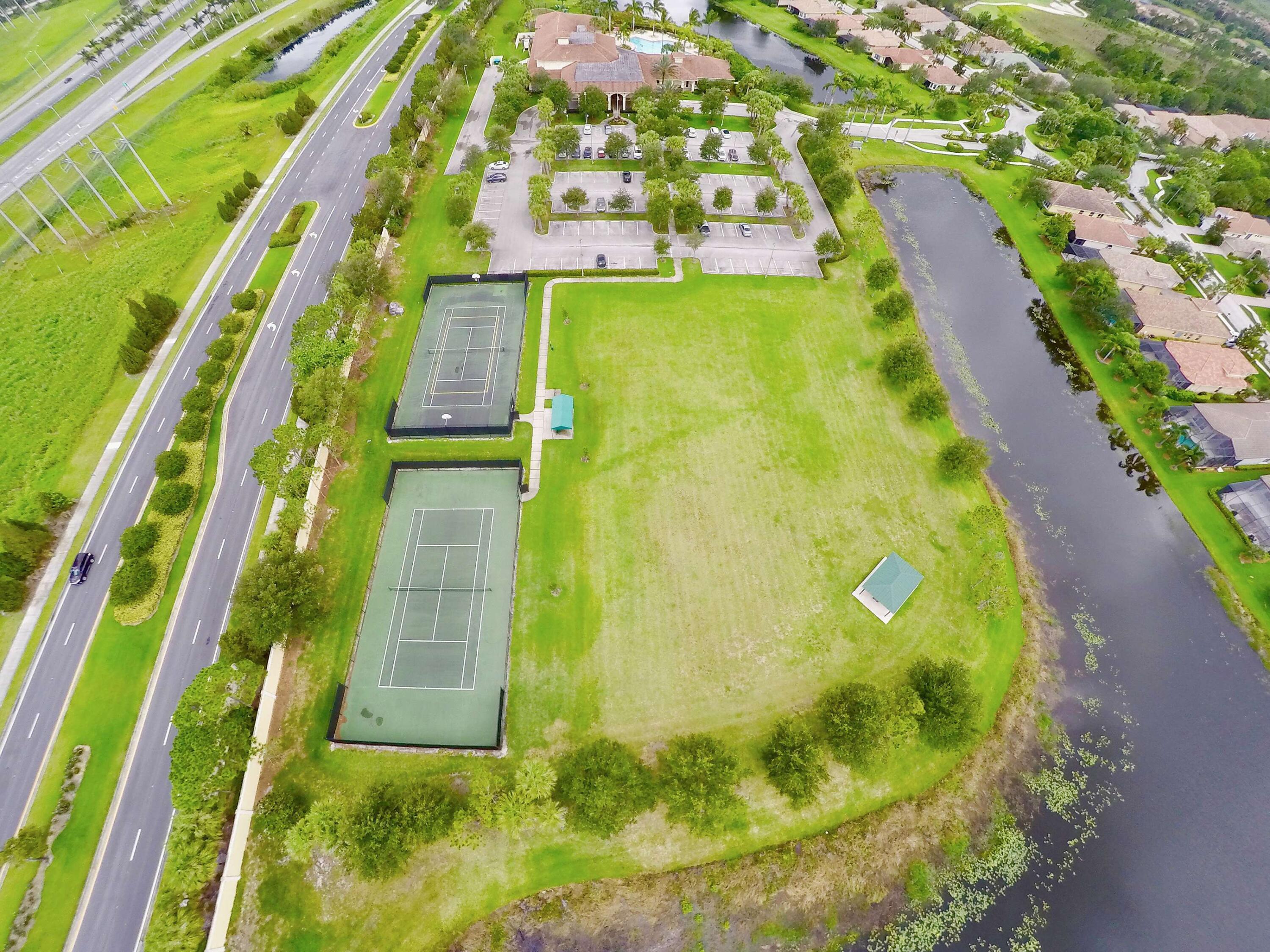 8938 First Tee Road Port St. Lucie, FL 34986 - Photo 34 of 36 16 - Tennis Court Aerial