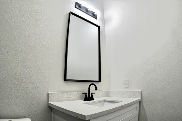 a bathroom with a shower and a mirror