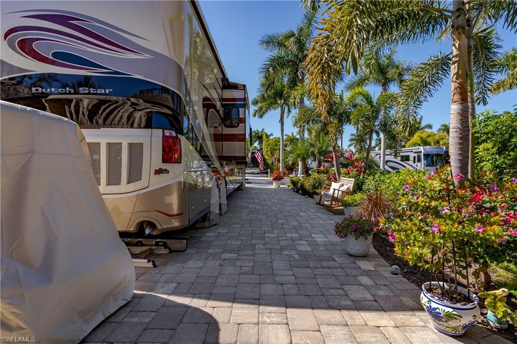 13583 Snook Circle Naples, FL 34114 - Photo 19 of 47 a view of a chairs and table in the patio