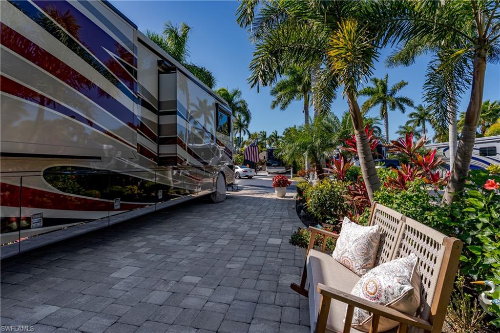 13583 Snook Circle Naples, FL 34114 - Photo 20 of 47 a view of outdoor seating area with lots of trees