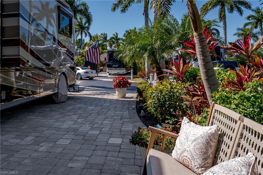 13583 Snook Circle Naples, FL 34114 - Photo 27 of 47 a view of outdoor space with seating area