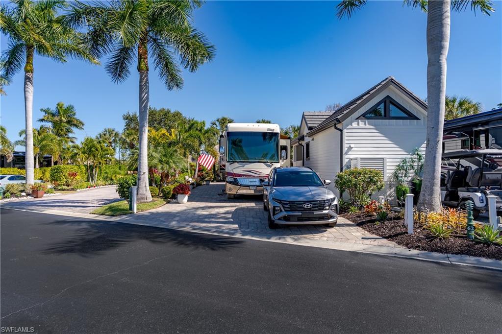 13583 Snook Circle Naples, FL 34114 - Photo 33 of 47 a car parked in front of a house