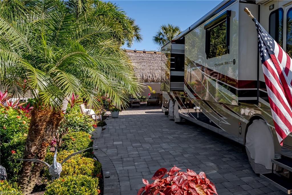 13583 Snook Circle Naples, FL 34114 - Photo 37 of 47 a backyard of a house with lots of green space