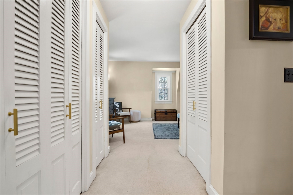 396 Main Street Boxford, MA 01921 - Photo 28 of 41 a view of a hallway with couch and furniture