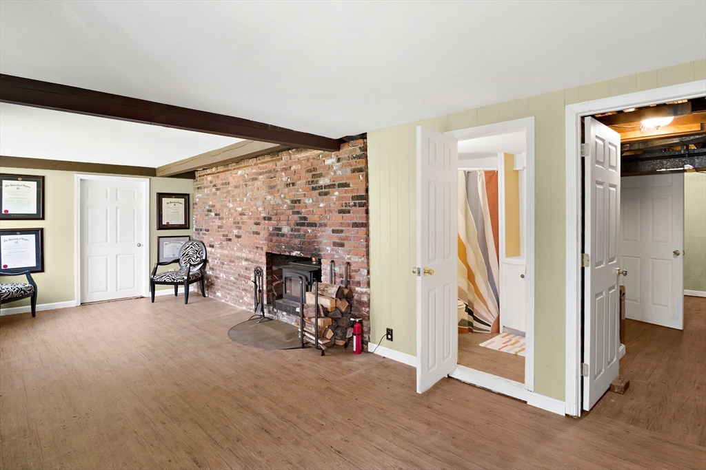 396 Main Street Boxford, MA 01921 - Photo 32 of 41 a view of a livingroom with a fireplace and workspace