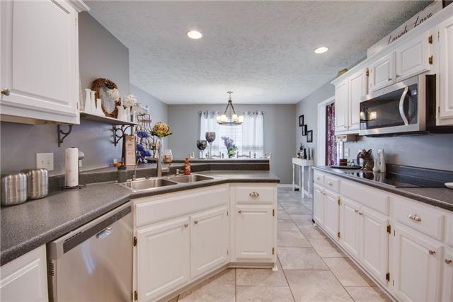 819 Marvin Layne Road Mount Juliet, TN 37122 - Photo 8 of 20 Tile continues throughout this crisp updated kitchen with tons of cabinet space.