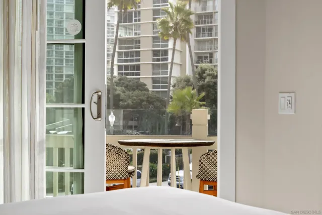 a spacious bathroom with a tub and a large mirror