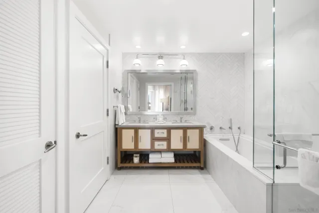 a bathroom with a sink vanity and a mirror