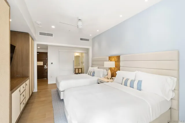 a bedroom with a bed and a mirror