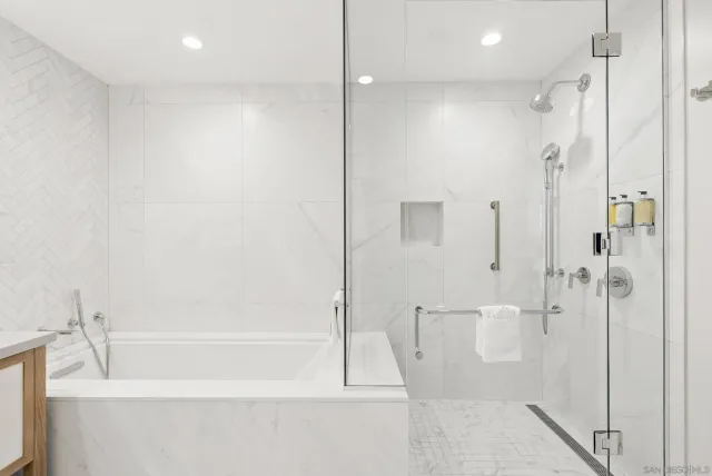 a dining room with furniture a rug and a chandelier