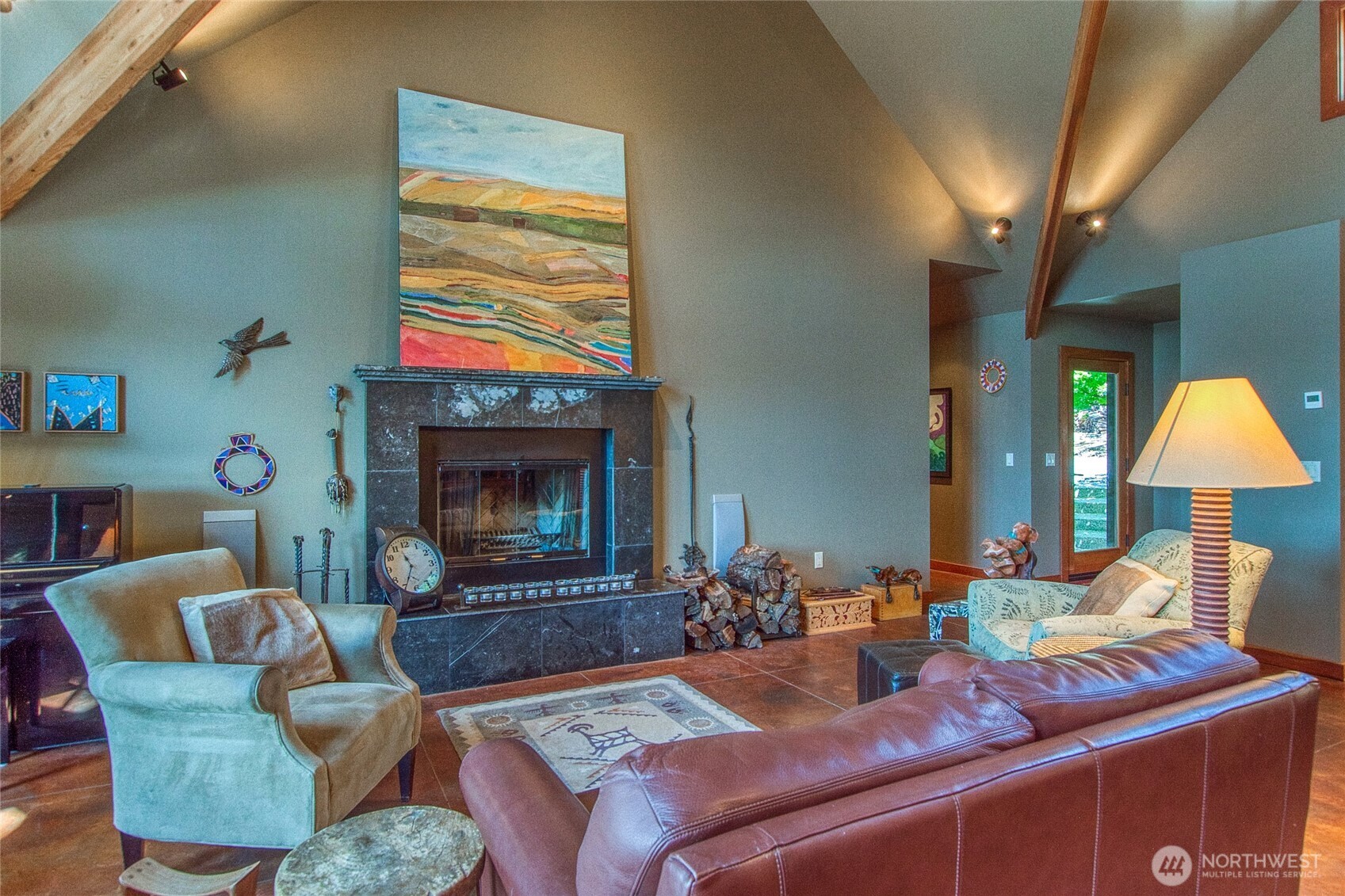 64 Hammond Lane Orcas Island, WA 98245 - Photo 12 of 39 a living room with furniture a fireplace and a flat screen tv