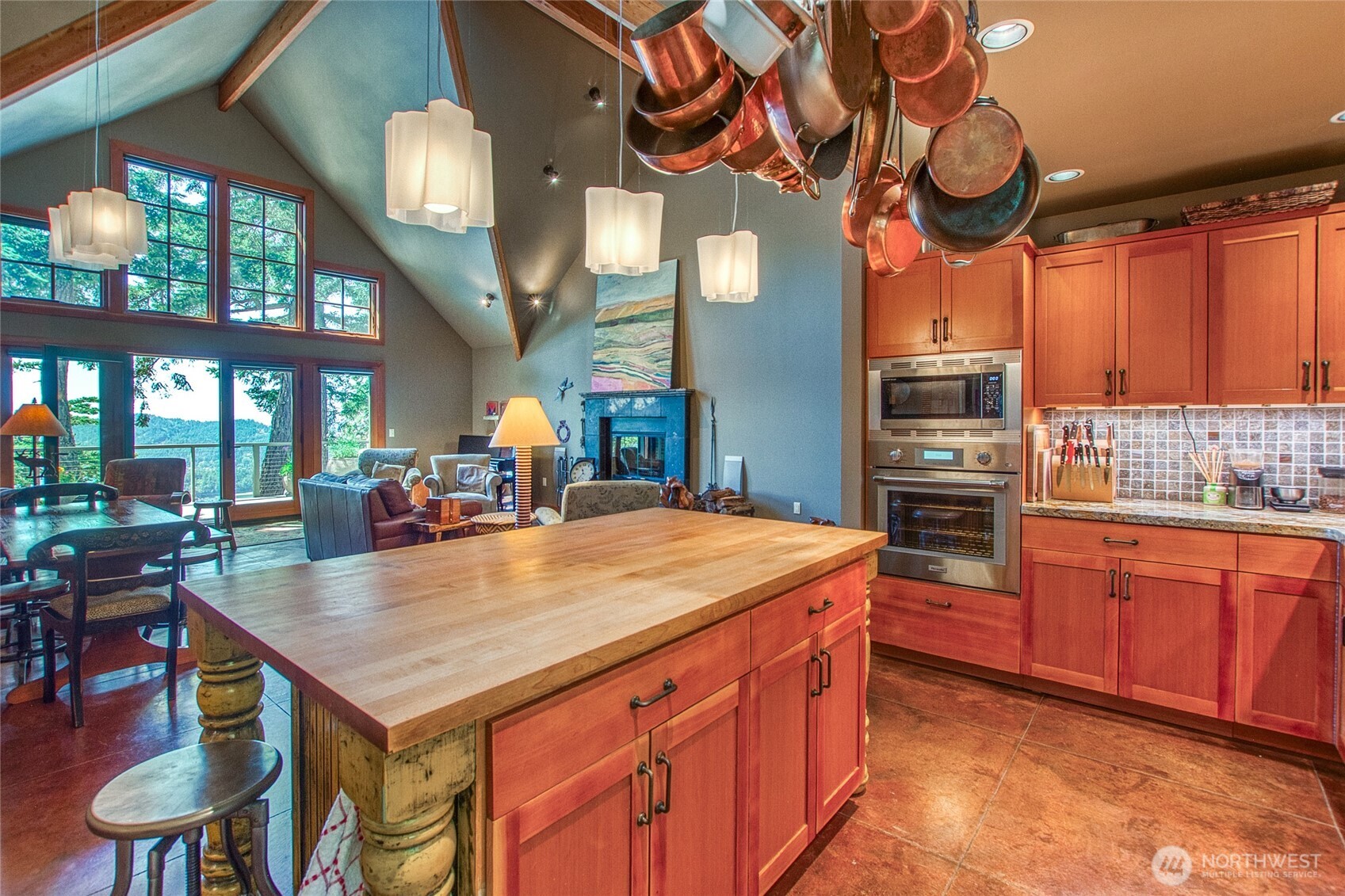 64 Hammond Lane Orcas Island, WA 98245 - Photo 15 of 39 a kitchen with stainless steel appliances granite countertop a sink a stove and a wooden floors