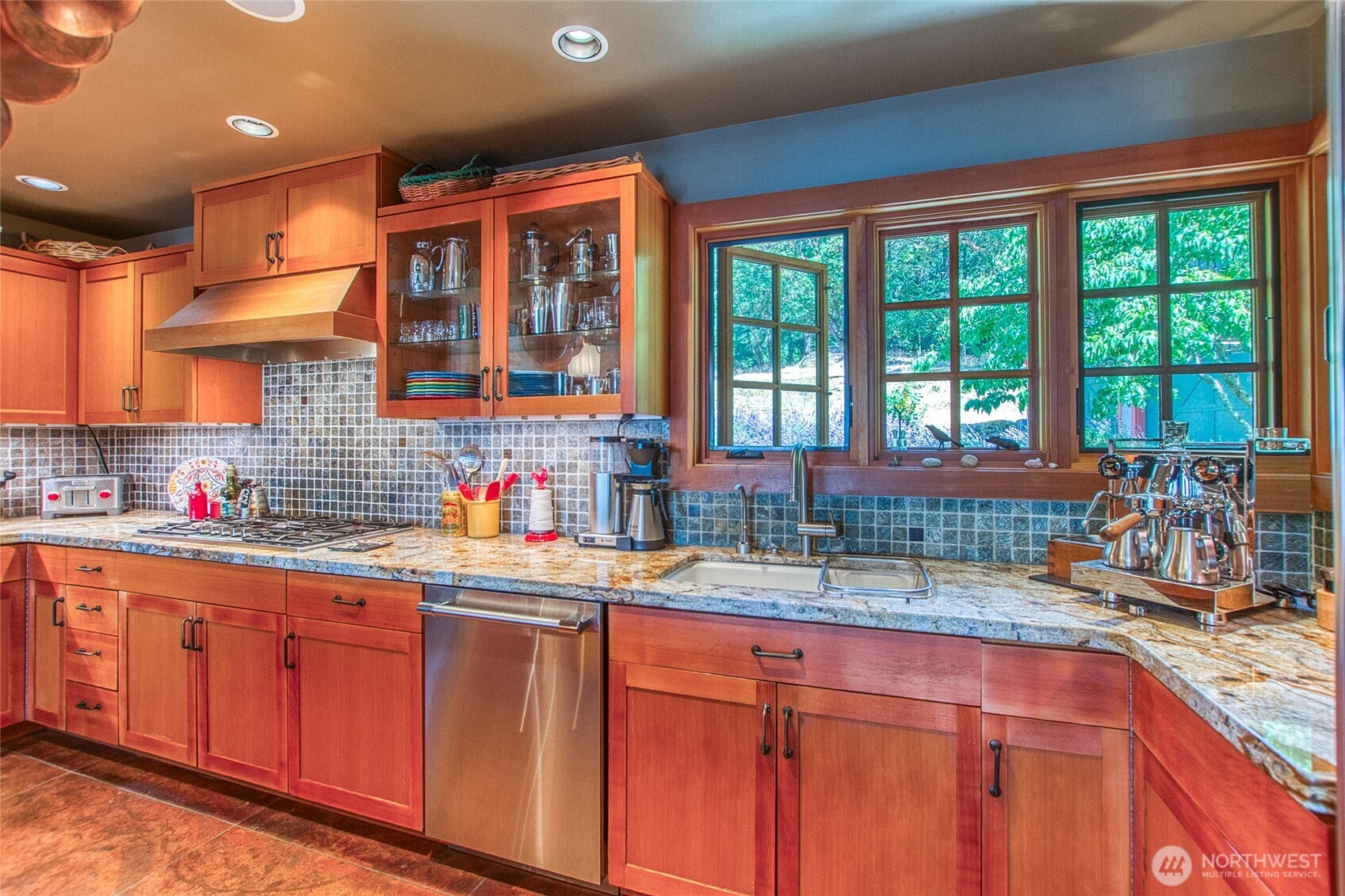 64 Hammond Lane Orcas Island, WA 98245 - Photo 17 of 39 a kitchen with stainless steel appliances a sink and cabinets