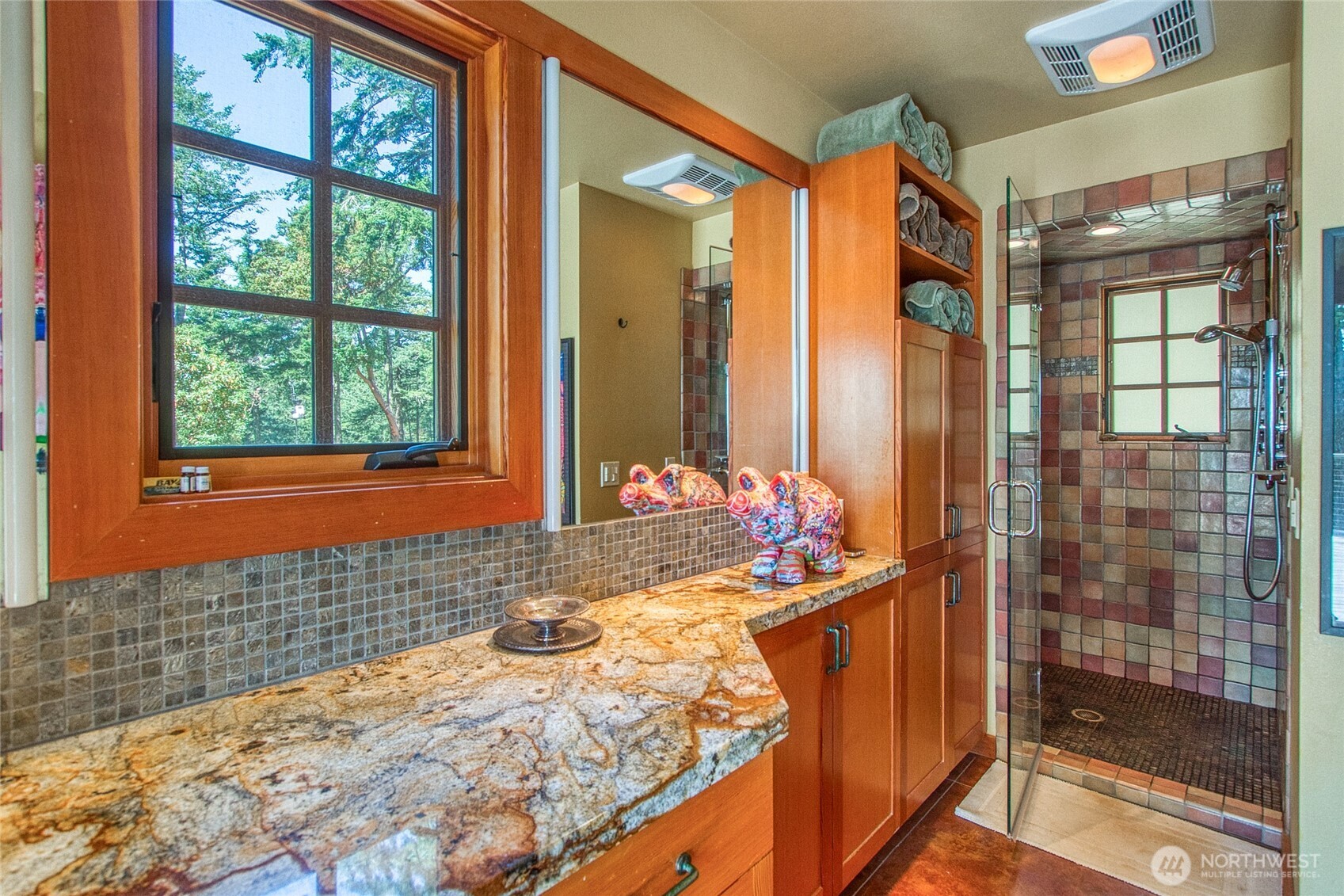 64 Hammond Lane Orcas Island, WA 98245 - Photo 21 of 39 a bathroom with a granite countertop sink a mirror and shower