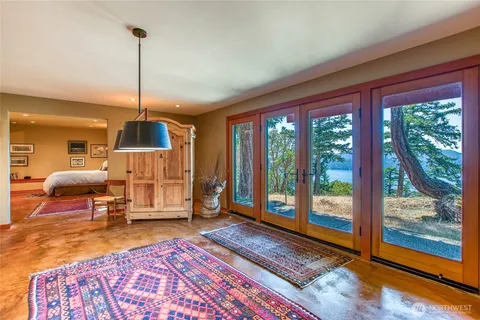 a living room with furniture rug and wooden floor