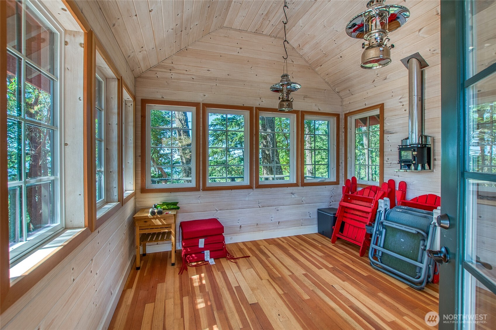 64 Hammond Lane Orcas Island, WA 98245 - Photo 37 of 39 a living room with furniture and a floor to ceiling window