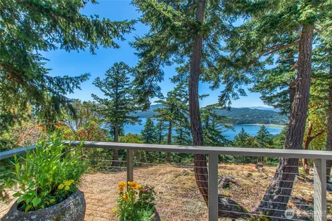 a view of a balcony with lake from a balcony