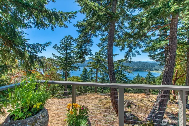 a view of a balcony with lake from a balcony