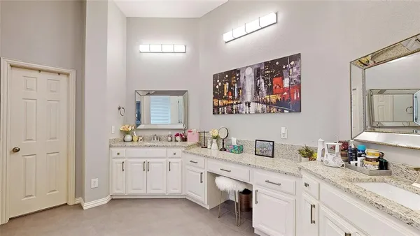 a bathroom with a sink a vanity and a mirror
