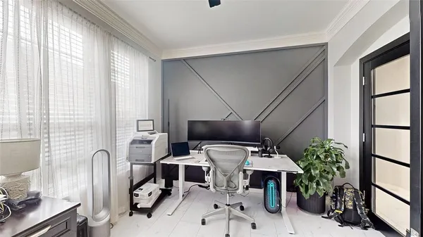 a work place with furniture and potted plant