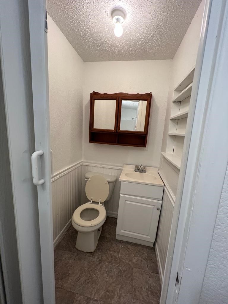 1272 Pecan Street, Unit B Clute, TX 77531 - Photo 6 of 10 a white toilet sitting next to a white toilet