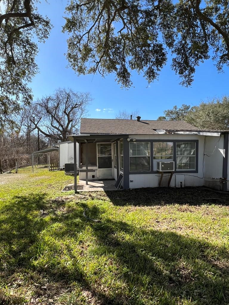 1272 Pecan Street, Unit B Clute, TX 77531 - Photo 7 of 10 a front view of a house with yard porch and sitting area