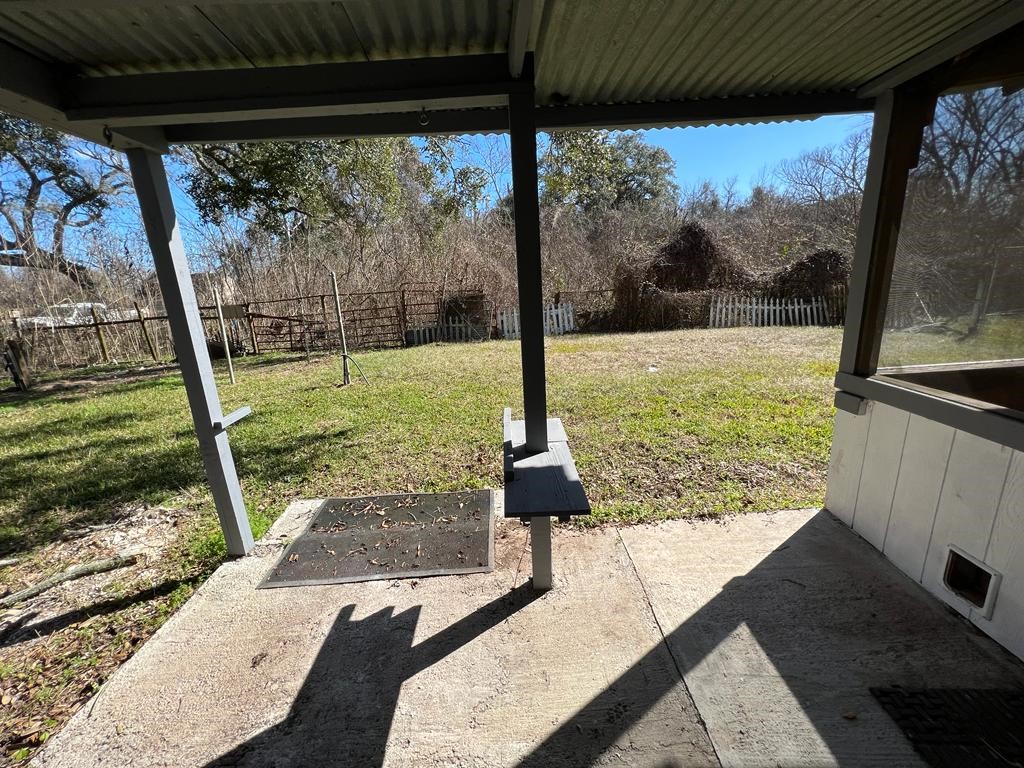 1272 Pecan Street, Unit B Clute, TX 77531 - Photo 9 of 10 a view of a porch and garden
