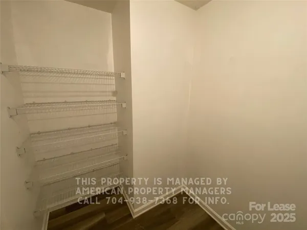 a view of door with hardwood floor