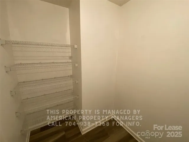 a view of door with hardwood floor