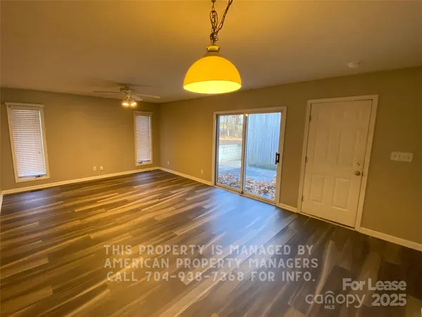 a view of room with wooden floor