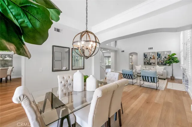a view of a patio with table and chairs potted plants