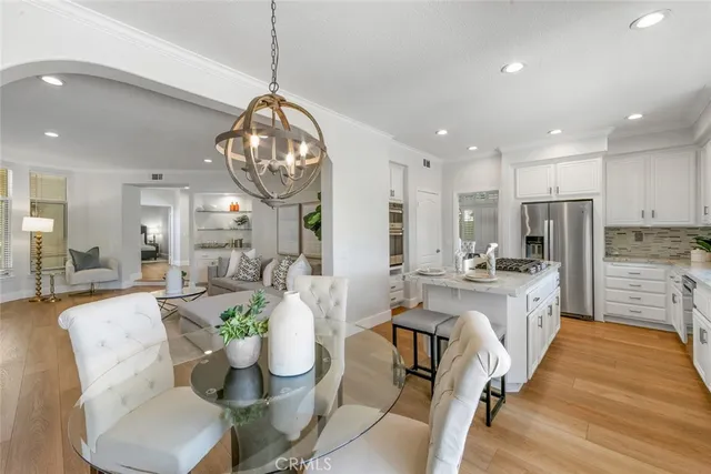 a view of a house with a yard and potted plants