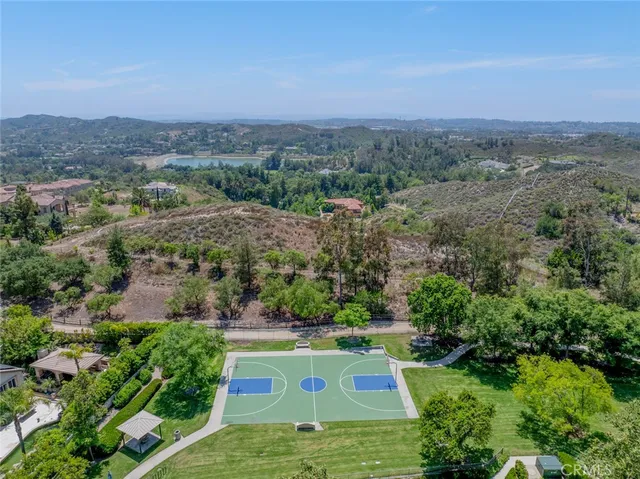 a spacious bedroom with a bed and a large window