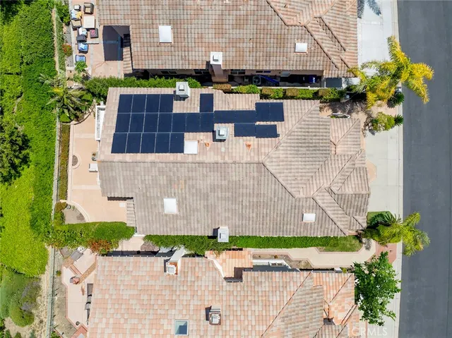 a bed room with a bed and a chandelier