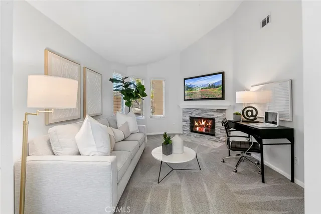a view of a hallway with wooden floor and entryway