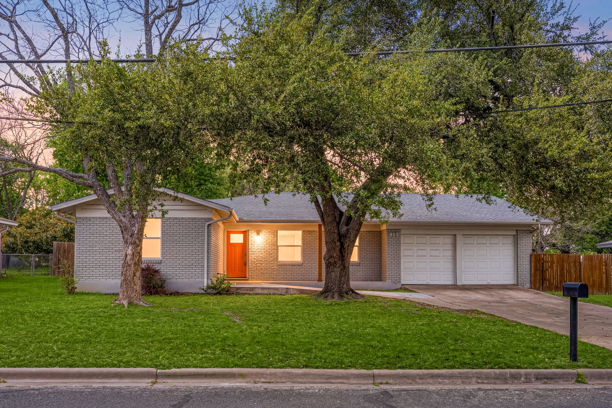 11800 Oak Haven Road Austin, TX 78753 - Photo 1 of 37 a front view of a house with a garden and trees
