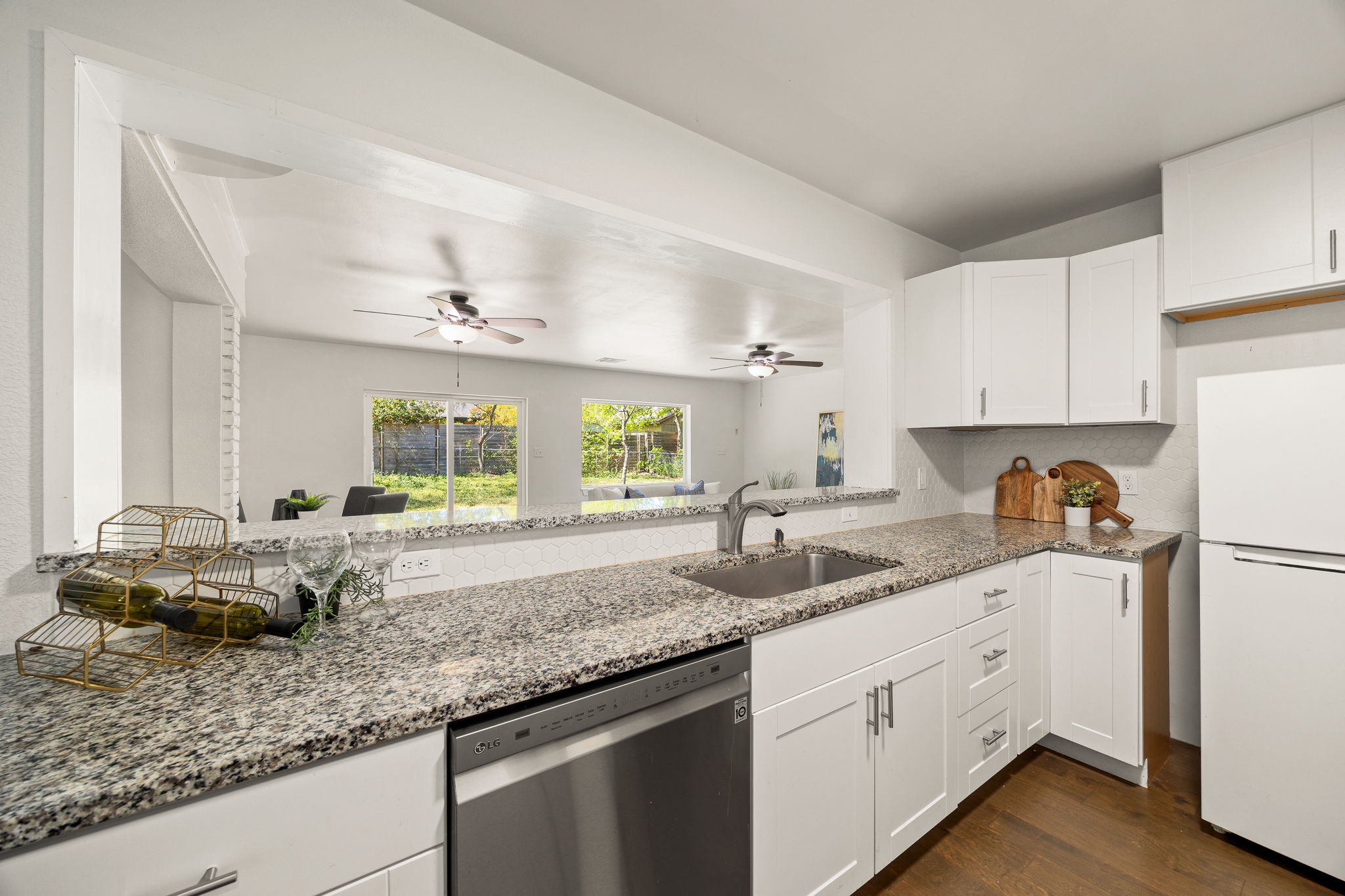 11800 Oak Haven Road Austin, TX 78753 - Photo 12 of 37 a kitchen with granite countertop a sink cabinets and window