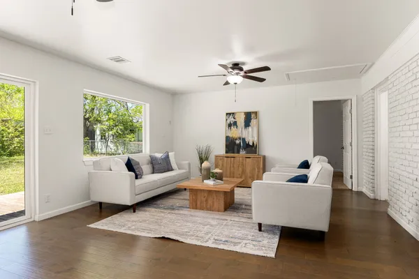 a living room with furniture and a large window