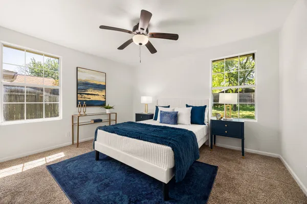 a bed room with a bed and a window