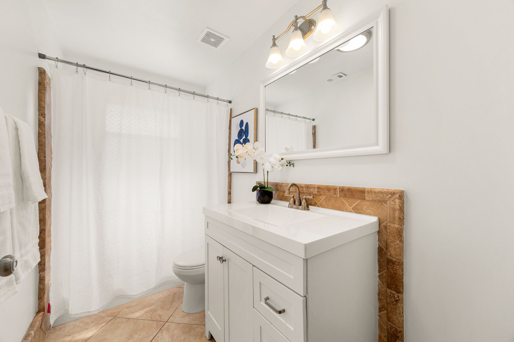 11800 Oak Haven Road Austin, TX 78753 - Photo 31 of 37 a bathroom with a sink vanity and a mirror