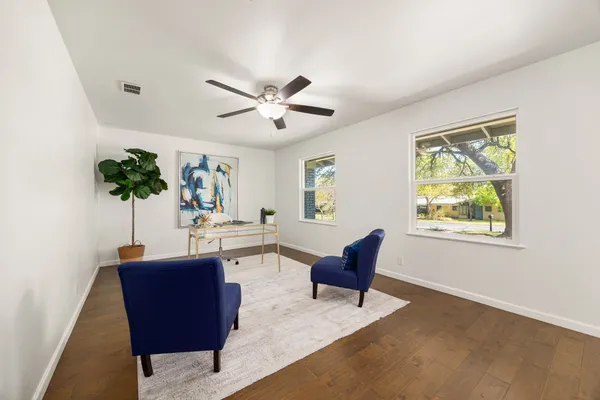 a view of a livingroom with furniture and a potted plant