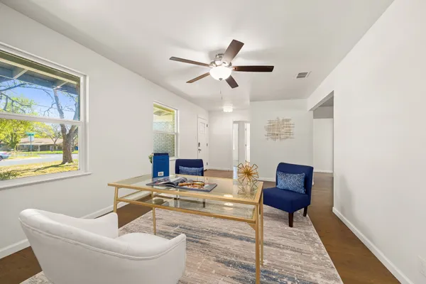 a living room with furniture and a window