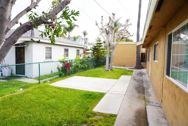 an aerial view of a house with outdoor space