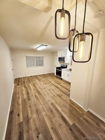 a view of a city with lush green forest