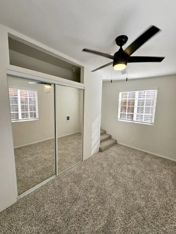 a bathroom with a bathtub shower sink vanity and toilet