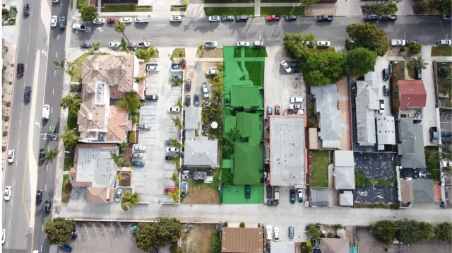 an aerial view of residential house with outdoor space and street view