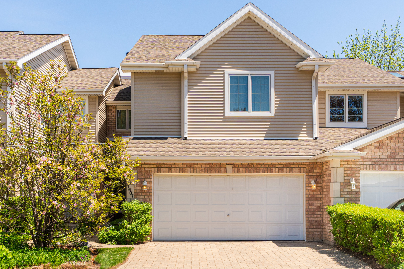 a view of a house with a yard and plants